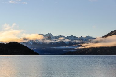 Low morning clouds in Glenorchy, New Zealand clipart