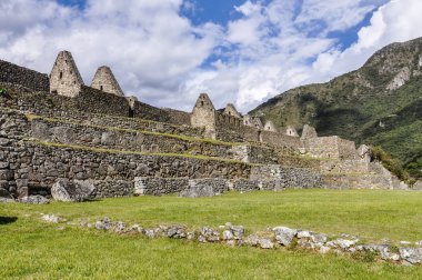 Between the houses at Machu Picchu, the sacred city of Incas, Pe