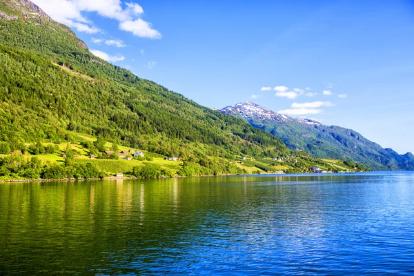 Meadows and village on Hardanger Fiord. — Stock Photo, Image