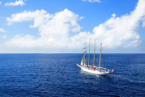 Yacht is sailing on the Caribbean sea on a sunny day.