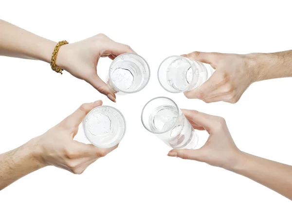 Hands holding water glass cheering — Stock Photo, Image