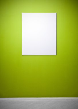 Blank picture poster in a green gallery wall
