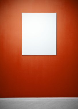 Blank picture poster in a red gallery wall