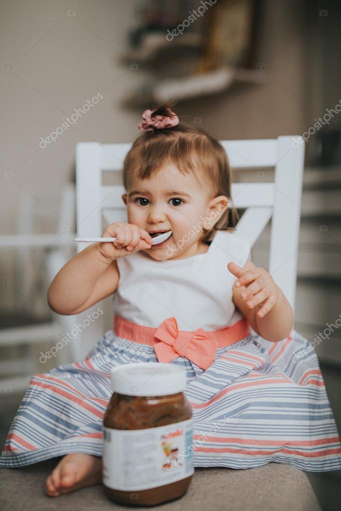 funny baby eating chocolate