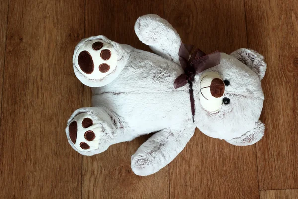 Toy bear lying on the floor — Stock Photo, Image