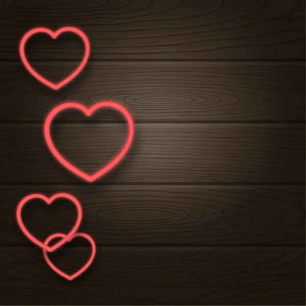 Glowing heart on wooden background. Valentines Day or Wedding card design.
