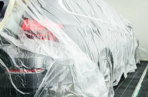 Luxury Car Covered By Car Paint Protection Foil, Disassembled And Prepared For Painting In Professional Vehicle Paint Booth By Spray. Process Of Vehicle Painting In Car Service. Jpeg Image — Stock Photo, Image