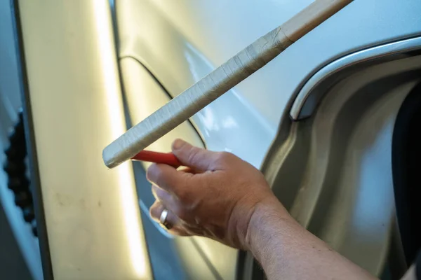 Process Of Paintless Dent Repair On Car Body. Technician s Hands With Puller Fixing Dent On Rear Car Fender. PDR Removal Course Training — 스톡 사진