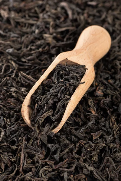 Black tea leaves background