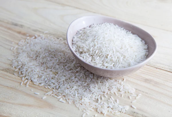 Uncooked rice in a bowl Royalty Free Stock Photos