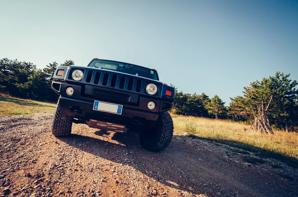 Hummer H2 on the road. — Stock Photo, Image