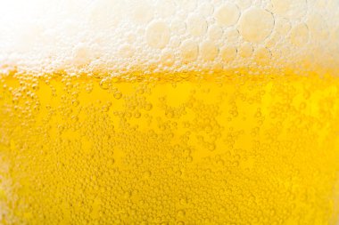 Arka plan doku köpük ve kabarcıklar ile soğuk bira