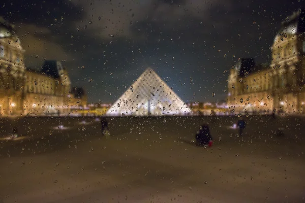 Abstract blurry background with water drops: view through the window Paris by night France — Stock Photo, Image