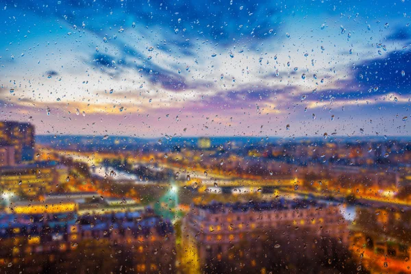 Abstract blurry background with water drops: view through the window Paris by night France — Stock Photo, Image