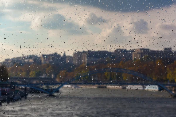 Abstract blurry background with water drops: view through the window Paris France — Stock Photo, Image