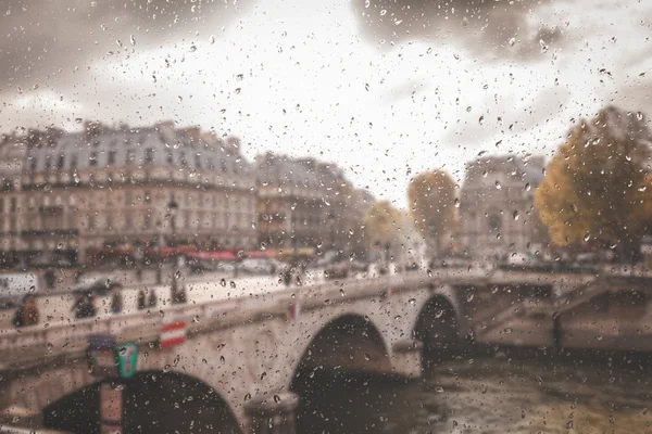 Abstract blurry background with water drops: view through the window Paris France — Stock Photo, Image