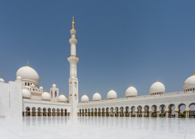 ABU DHABI, UAE - MAY 13, 2014: Sheikh Zayed Mosque in Abu Dhabi, considered to be the key for worship in the United Arab Emirates clipart