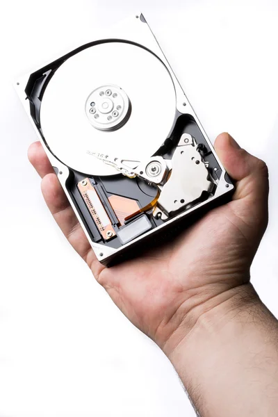 Male technician hand holding computer hard drive over white back — Stock Photo, Image