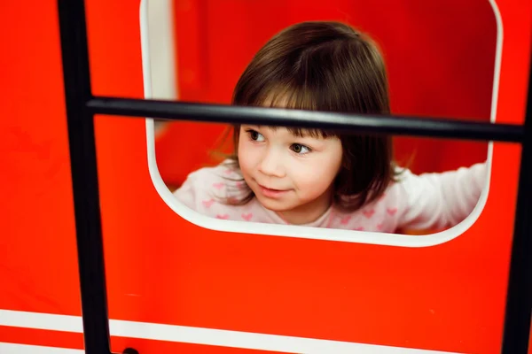 Active cute little girl on playground — Stock Photo, Image