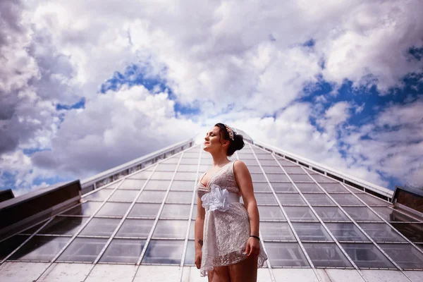 Girl in white dress enjoying the warmth of the sun — Stock Photo, Image