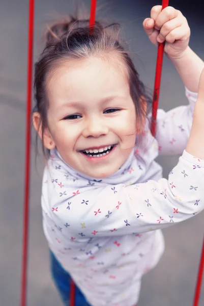 Small cute girl in a park — Stock Photo, Image