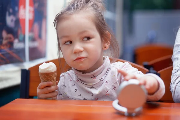 Baby girl looks suspiciously — Stock Photo, Image