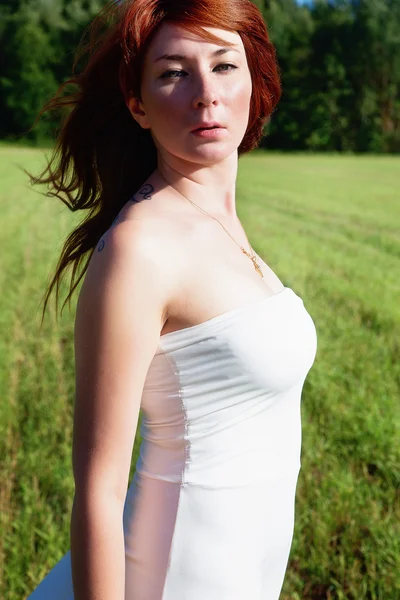 Girl in a white dress and sunny day — Stock Photo, Image