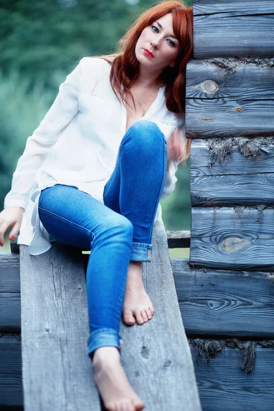 Girl in white shirt and jeans — Stock Photo, Image