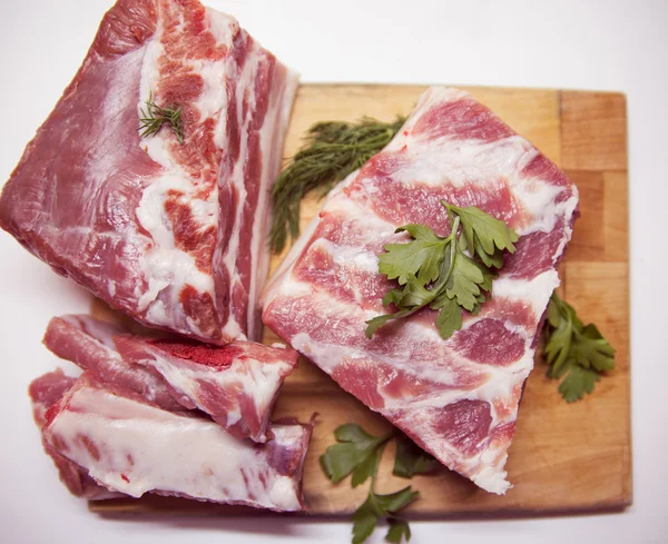 Pork belly slice on a wooden board — Stock Photo, Image