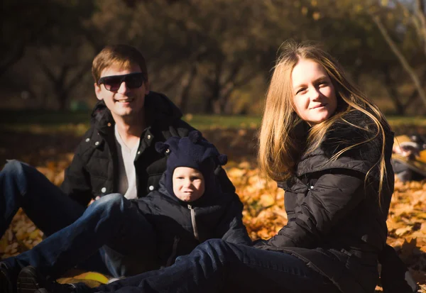 Picture of lovely family in autumn park — Stock Photo, Image