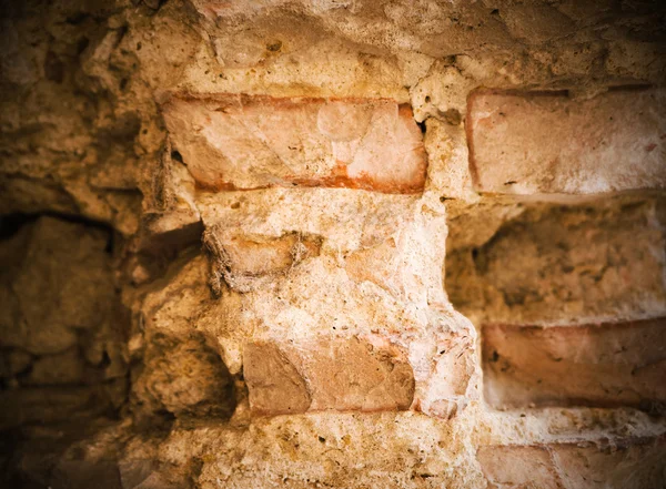 It depicts an old brick wall crumbling — Stock Photo, Image