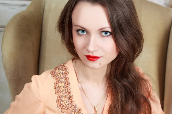 Retro, vintage portrait of a beautiful girl sitting in the chair — Stock Photo, Image