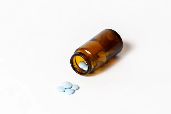 Medication next to the bottle — Stock Photo, Image