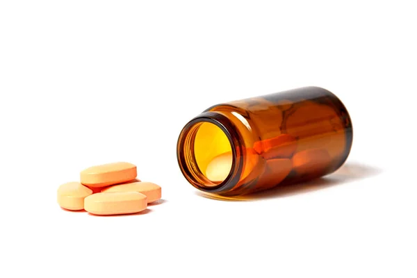 Medication next to the bottle — Stock Photo, Image