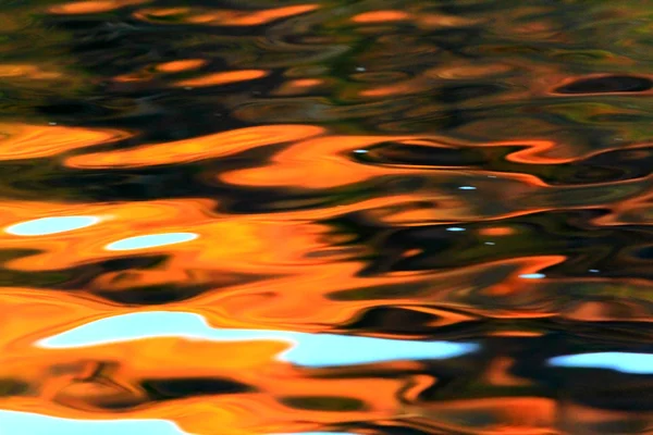 Orange reflections in the water — Stock Photo, Image