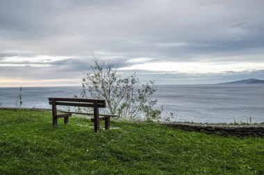 Bench looking over the Cantabrian Sea clipart