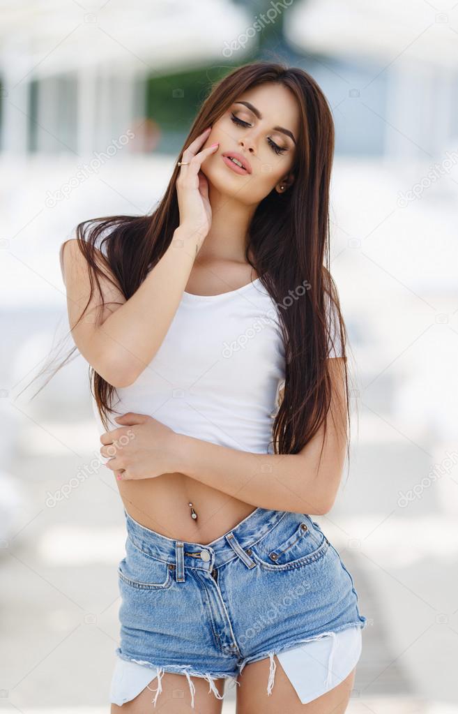 Sexy girl in jeans shorts on a beach Stock Photo by ©dens22us@rambler.ru  116091792