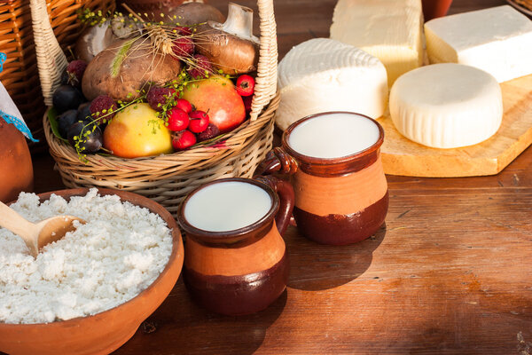 Dairy products on wooden table.