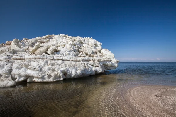 Ice hummocks swim in the sea