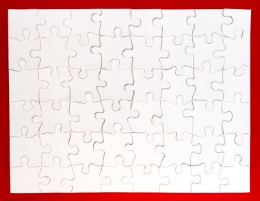 Completed White Jigsaw Puzzle on Red Background clipart