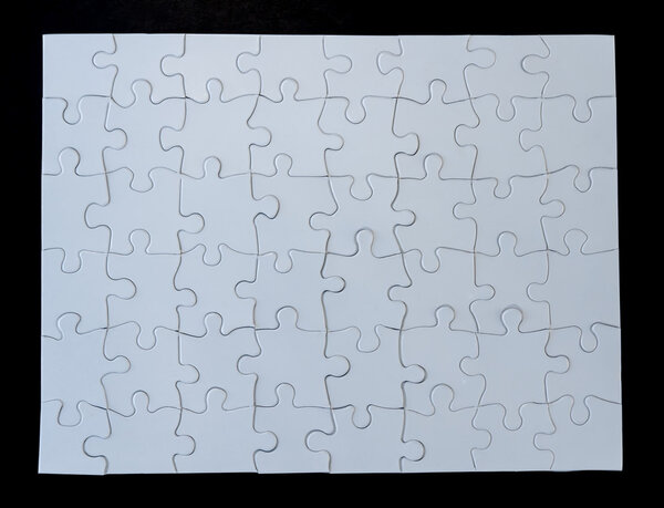 Completed White Jigsaw Puzzle on Black Background