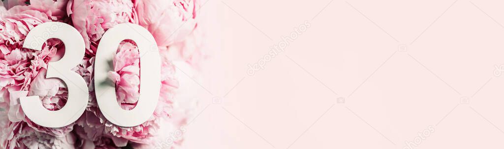 Peony flowers, digit thirty. Birthday greeting card with inscription 30. Anniversary concept. Top view. White numeral on flower background. Numerical digit, Celebration event, template, flyer.