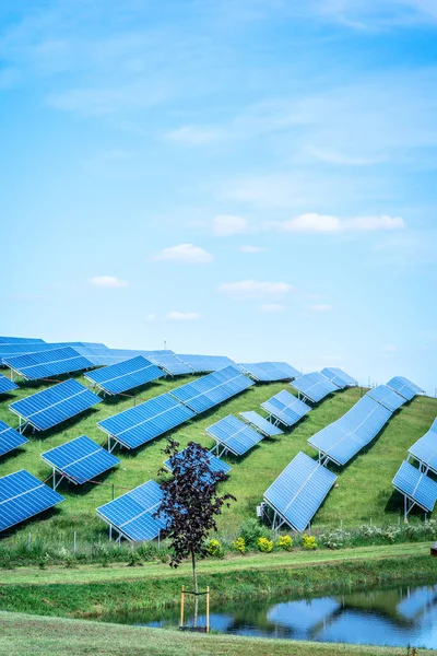 Blue solar panel background of photovoltaic modules for renewable energy. Copy space. Banner. Solar panels against blue sunny sky produce green, environmentally friendly energy from sun