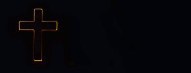 Silhouette of christian cross, lights, bokeh on black background. Copy space. Faith symbol. Church worship, salvation concept. Faith symbol in Jesus Christ. Holy cross for Easter day. Christianity.