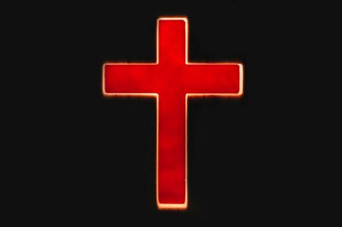 Silhouette of christian cross, lights, bokeh on black background. Copy space. Faith symbol. Church worship, salvation concept. Faith symbol in Jesus Christ. Holy cross for Easter day. Christianity.