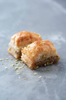 Turkish dessert chocolate baklava on grey background. Top view. Copy space. Set of assorted traditional eastern desserts. Arabian sweets, turkish delight.