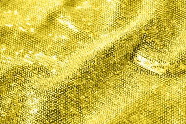 Altın pullu ve parıltılı arka plan. Tatil ve kutlama için fotokopi alanı olan şenlikli dokuma. 2021 yılının modaya uygun rengini gösteriyor. Aydınlatıcı sarı ve nihai gri. Duotone.