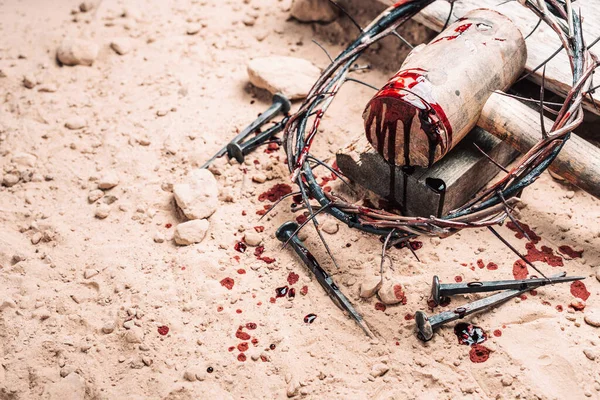 Good Friday, Passion of Jesus Christ. Crown of thorns, hammer, bloody nails on ground. Christian Easter holiday. Top view, copy space. Crucifixion, resurrection of Jesus Christ. Gospel, salvation.