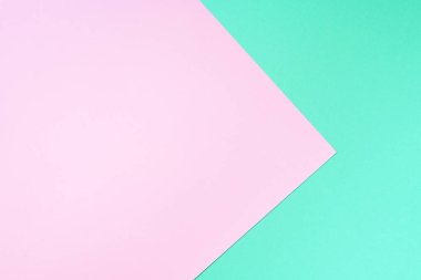 Moda yeşili ve pembe renkli arka plan. Modaya uygun bir kağıt. Üst Manzara. Minimum konsept. Modaya uygun nane rengi