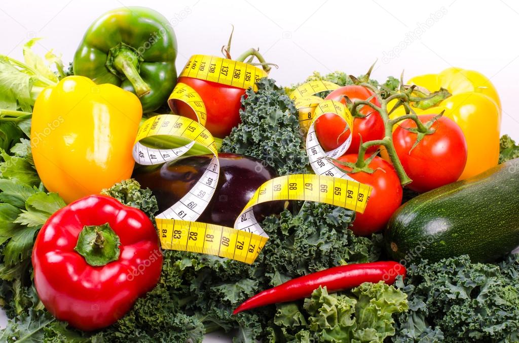 Vegetables and measuring tape, Diet concept